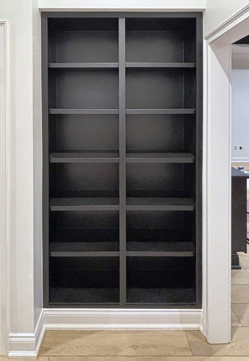 Built-in shelving painted black